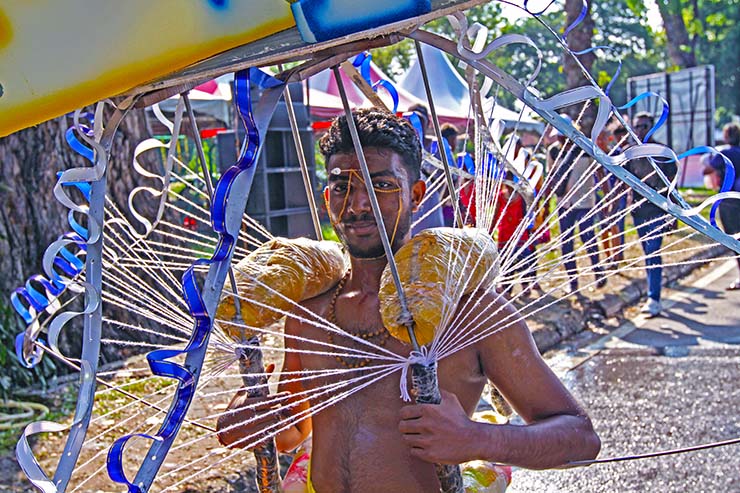 Hindu devotee carrying a mayil kavadi during Thaipusam in Penang, Malaysia; photo by Ivan Kralj.