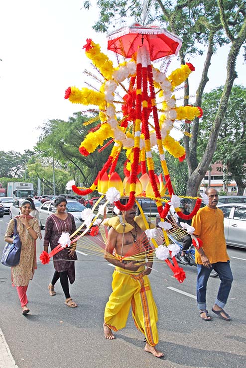 Hindu devotee carrying a mayil kavadi during Thaipusam in Penang, Malaysia; photo by Ivan Kralj.