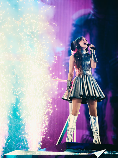 Emmy, a singer and songwriter from Norway, performing "Laika Party" at the Eurovision Song Contest in Basel, Switzerland, for Ireland; photo by Alma Bengtsson / EBU.