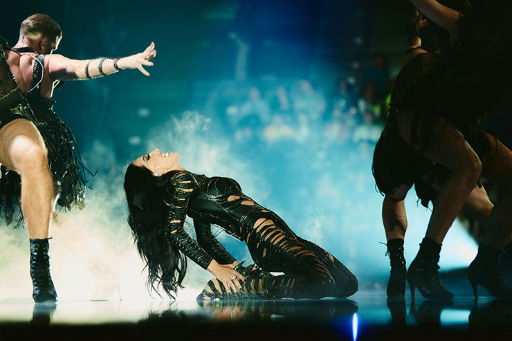 Photograph of Justyna Steczkowska with a dancing crew in high heels performing her song "Gaja" for Poland at Eurovision Song Contest in Basel, Switzerland; photo by Alma Bengtsson / EBU.