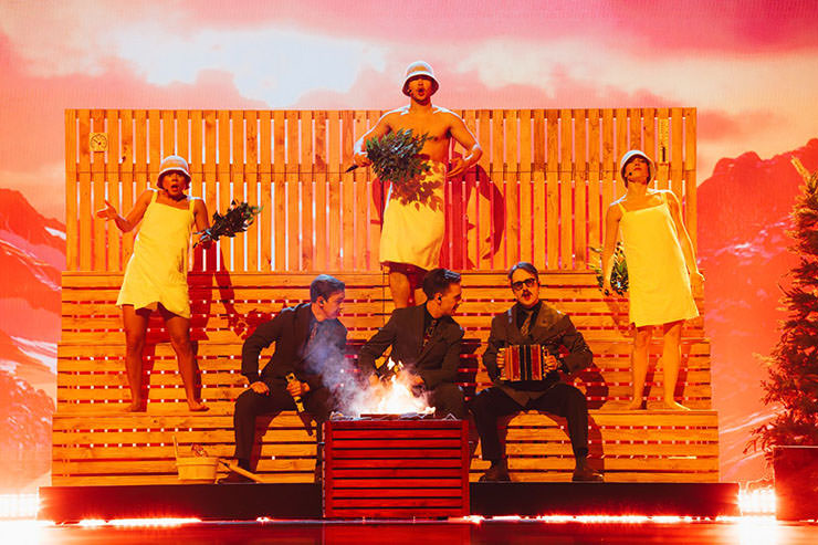 Finnish group KAJ performing "Bara Bada Bastu" song in a sauna-style set-up, representing Sweden at the Eurovision Song Contest in Basel, Switzerland; photo by Sarah Louise Bennett / EBU.
