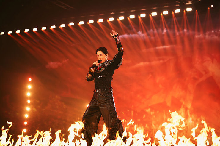 Kyle Alessandro rehearsing "Lighter" for Norway's Eurovision act at St. Jakobshalle, Basel, Switzerland, with a wall of fire in front of him; photo by Sarah Louise Bennett / EBU.