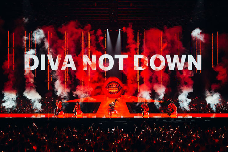 Miriana Conte from Malta performing "Serving" at the Eurovision 2025 in Basel, Switzerland, with "Diva Not Down" message displayed on the LED screen; photo by Sarah Louise Bennett / EBU.
