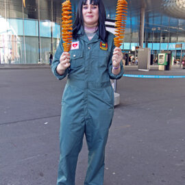 Cosplayer dressed as Anya from "Mouthwashing" psychological horror game, holding two tornado potatoes, at Fantasy Basel, the Swiss Comic Con; photo by Ivan Kralj.