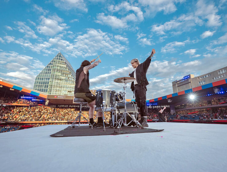 Baby Lasagna band, drummer and singer Marko Purišić, performing on the top of a cube stage at St. Jakob-Park stadium during the Arena Plus Eurovision pre-show; credit Kanton Basel-Stadt, photo by Mood Studios AG.