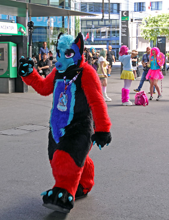 Piwipp, the furry, walking with a GoPro on a selfie stick at Basel Fantasy, the Swiss Comic Con; photo by Ivan Kralj.