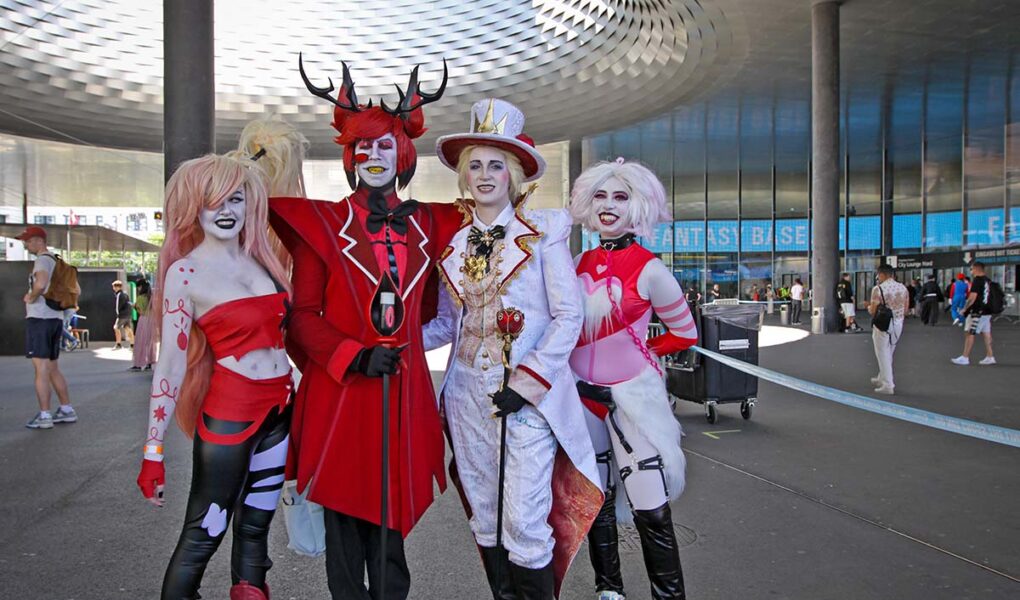Cosplayers dressed up as Vaggie, Alastor, Lucifer Morningstar, and Angel Dust from "Hazbin Hotel", the American adult animated TV series, at Fantasy Basel, the Swiss Comic Con, held at Messe Basel; photo by Ivan Kralj.