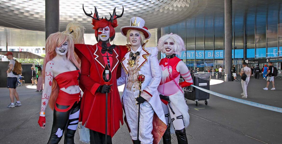 vibrant convention hall photograph showing Monsters series fans displaying collections and cosplaying as characters