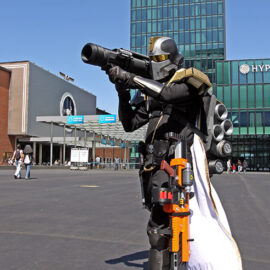 Cosplayer dressed as an elite warrior from "Helldivers" video game shooting from a rocket launcher at Fantasy Basel, the Swiss Comic Con; photo by Ivan Kralj.