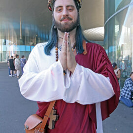 Cosplayer dressed as Jesus, praying at Fantasy Basel, the Swiss Comic Con; photo by Ivan Kralj.