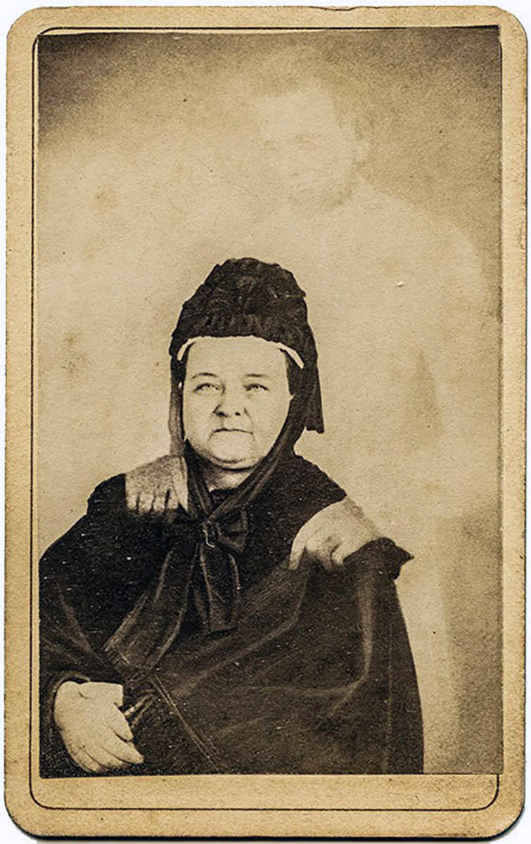 Mary Todd Lincoln, American First Lady, with a "ghost" of Abraham Lincoln, depicted by spirit photography of William H. Mumler.