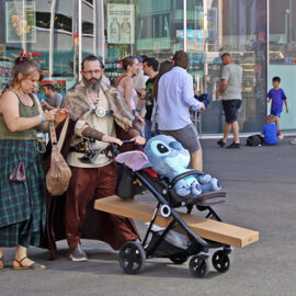 Cosplayers dressed up as medieval Vikings pushing Stitch toy in a baby carriage, at Fantasy Basel, the Swiss Comic Con; photo by Ivan Kralj.