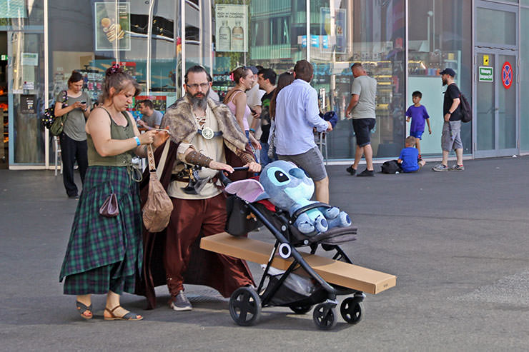 Cosplayers dressed up as medieval Vikings pushing Stitch toy in a baby carriage, at Fantasy Basel, the Swiss Comic Con; photo by Ivan Kralj.