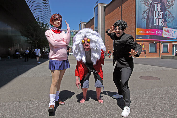 Momo Ayase, Turbo Granny, and Okarun; cosplayers embodying the characters from "Dandadan" manga series; shot at Fantasy Basel, the Swiss Comic Con, photo by Ivan Kralj.