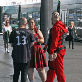 Cosplayers standing outside Messe Basel, among them a visitor dressed up as a robber in Netflix's "Money Heist" or "La casa de papel" heist crime drama TV series, at Fantasy Basel, the Swiss Comic Con; photo by Ivan Kralj.