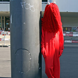 Cosplayer dressed as the Red Guy from "Don't Hug Me, I'm Scared" horror comedy web series, at Fantasy Basel, the Swiss Comic Con; photo by Ivan Kralj.