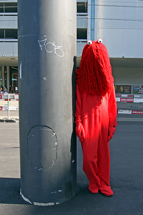 Cosplayer dressed as the Red Guy from "Don't Hug Me, I'm Scared" horror comedy web series, at Fantasy Basel, the Swiss Comic Con; photo by Ivan Kralj.