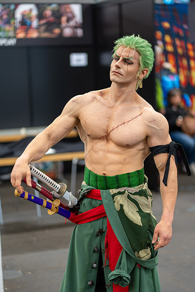 Italian cosplayer Taryn posing as Roronoa Zoro - Marimo from "One Piece"; credit Fantasy Basel, the Swiss Comic Con.