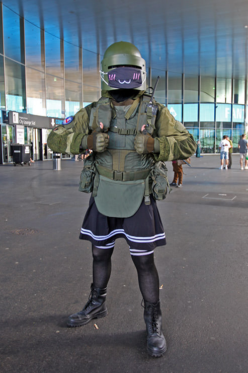 Cosplayer with a top part dressed as Tachanka from "Tom Clancy's Rainbow Six Siege" video game, and in the bottom part, wearing a skirt, at Fantasy Basel, the Swiss Comic Con; photo by Ivan Kralj.