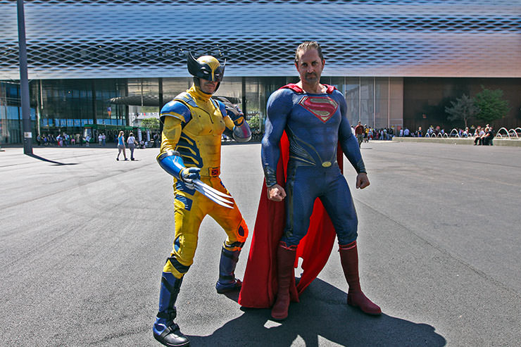 Cosplayers dressed up as Wolverine and Superman standing in front of the Messe Basel, the venue of Fantasy Basel, the Swiss Comic Con; photo by Ivan Kralj.