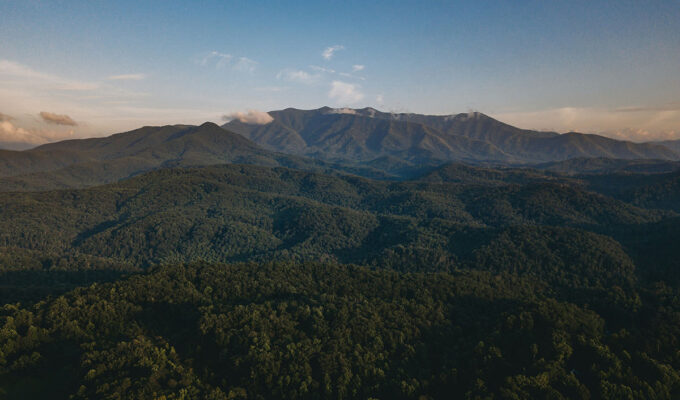 A tree-covered landscape of the Great Smoky Mountain National Park, as seen from Gatlinburg; photo by Steven Van Elk, Unsplash.