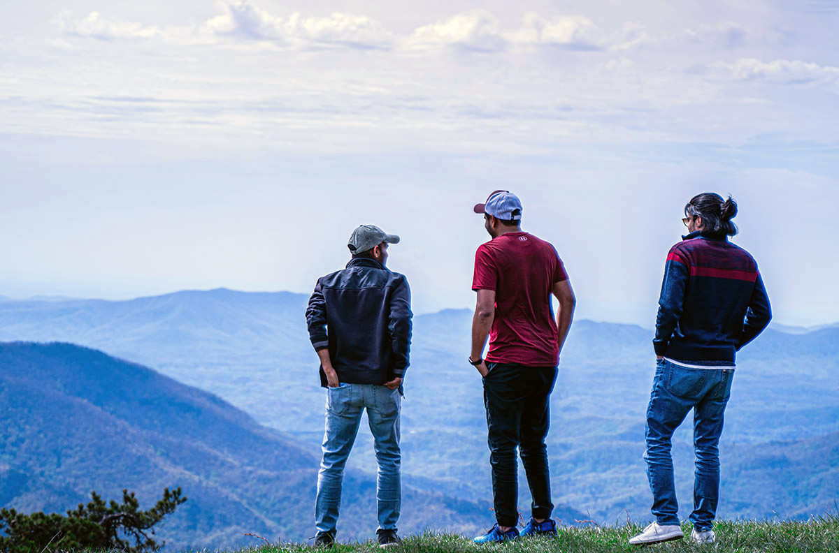 Men observing the landscape of the Great Smoky Mountains; photo by A n v e s h, Unsplash.