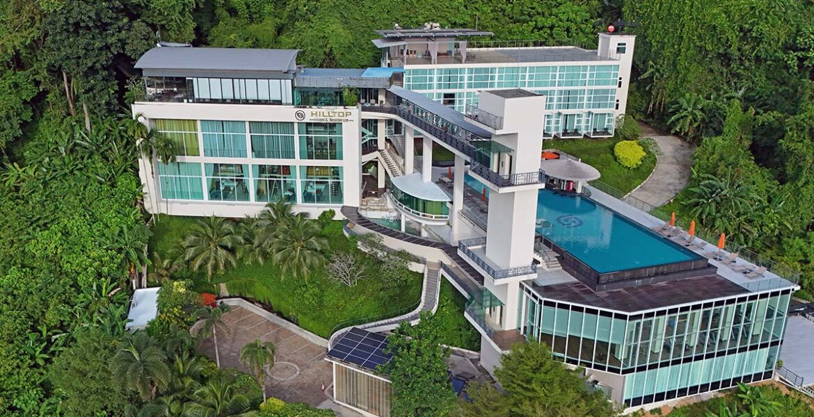 Aerial view of the Hilltop Wellness Resort exterior with an infinity swimming pool, in Phuket, Thailand; drone photo by Ivan Kralj.