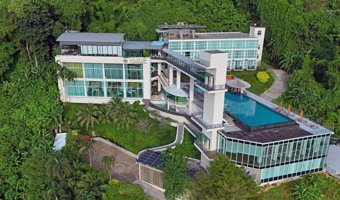 Aerial view of the Hilltop Wellness Resort exterior with an infinity swimming pool, in Phuket, Thailand; drone photo by Ivan Kralj.