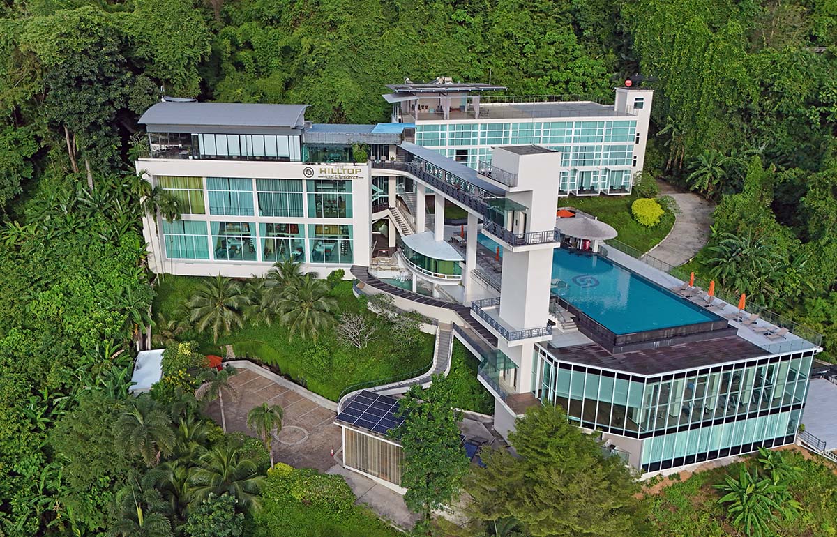 Aerial view of the Hilltop Wellness Resort exterior with an infinity swimming pool, in Phuket, Thailand; drone photo by Ivan Kralj.