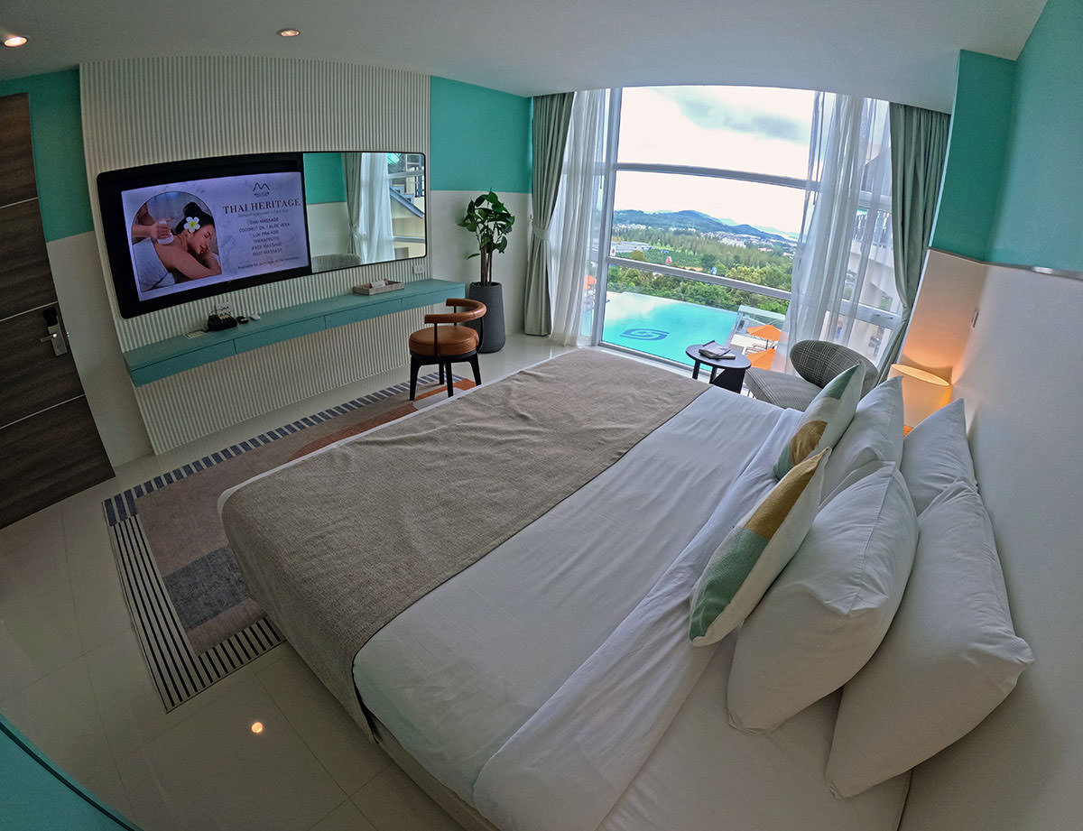 A bedroom in the suite with a pool view at Hilltop Wellness Resort in Phuket, Thailand; photo by Ivan Kralj.