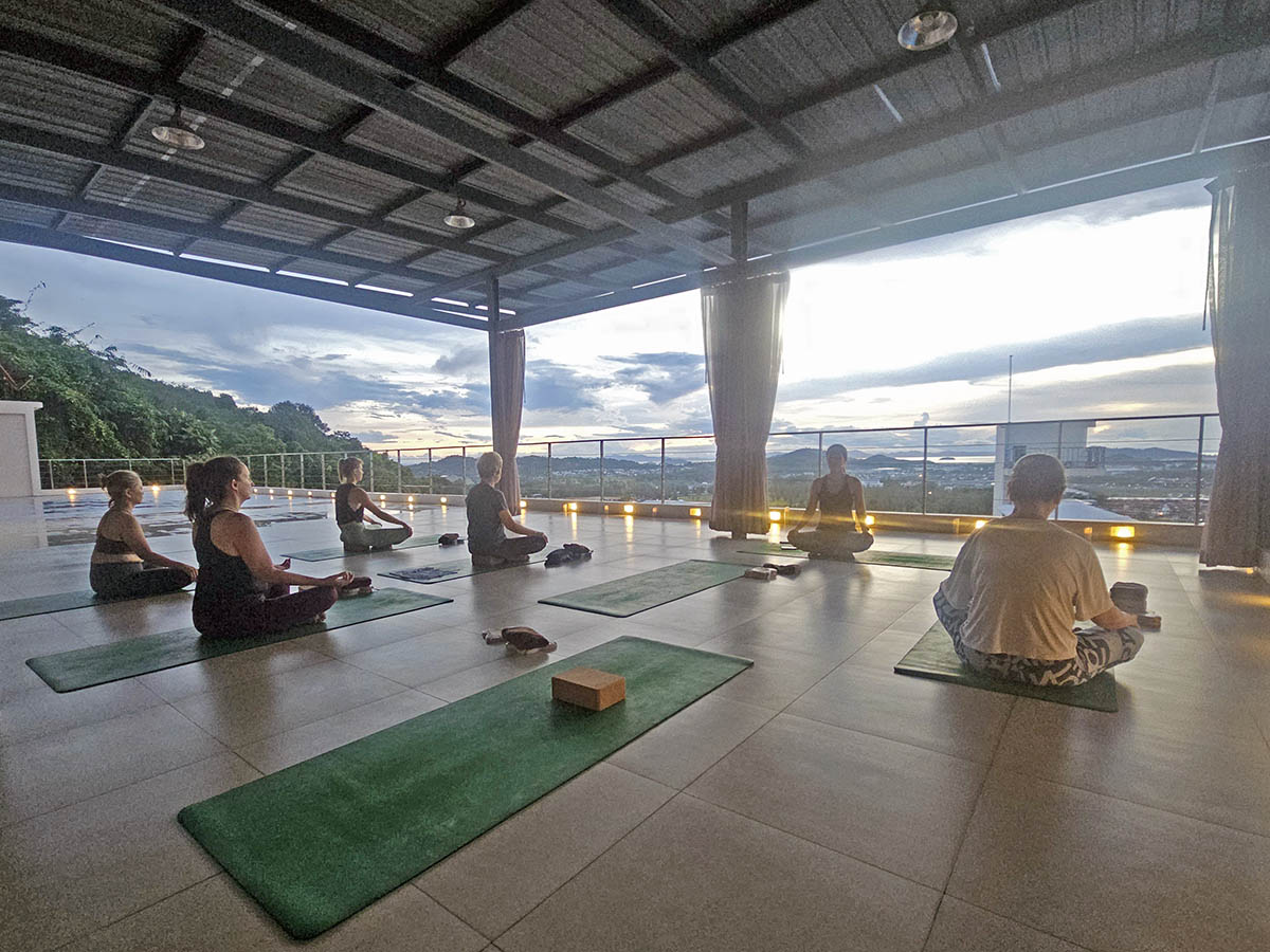 Sunrise yoga class led by an instructor Bamboo, on the rooftop of the Hilltop Wellness Resort in Phuket, Thailand; photo by Ivan Kralj.