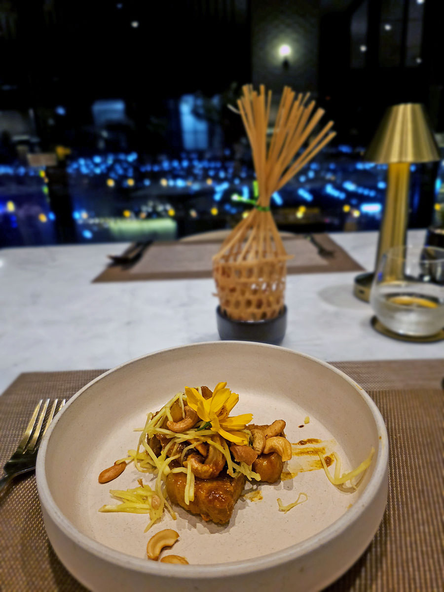 Northern-spiced tortillas with pork and hung lae curry, served as a part of the Chef's set menu at Plearn Restaurant, Hilltop Wellness Restaurant in Phuket, representing Northern Thailand cuisine; photo by Ivan Kralj.