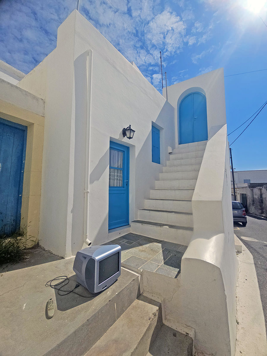 Abandoned TV appliance left on the street of Chora Kythira, Greece; photo by Ivan Kralj.