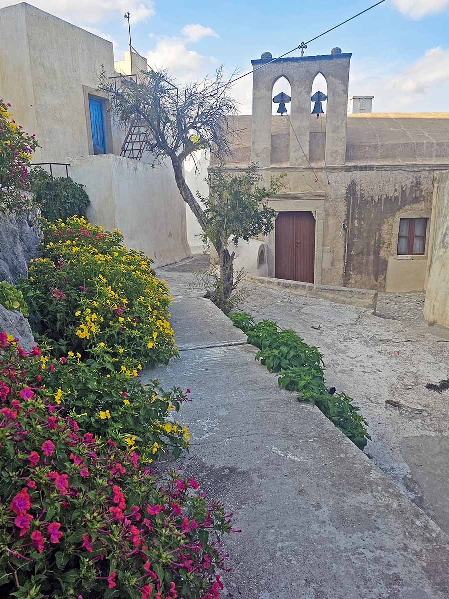 A Byzantine church in Mesa Vourgo neighborhood in Chora Kythira, surrounded by flowers, on Kythira Island, Greece; photo by Ivan Kralj.