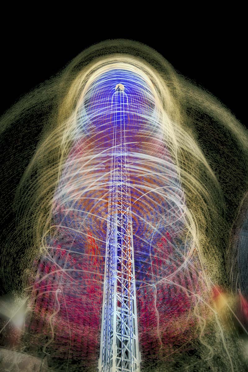 Chain carousel leaving a light trail during night at Basler Herbstmesse (Basel Autumn Fair); artistic photo by PiConsti.