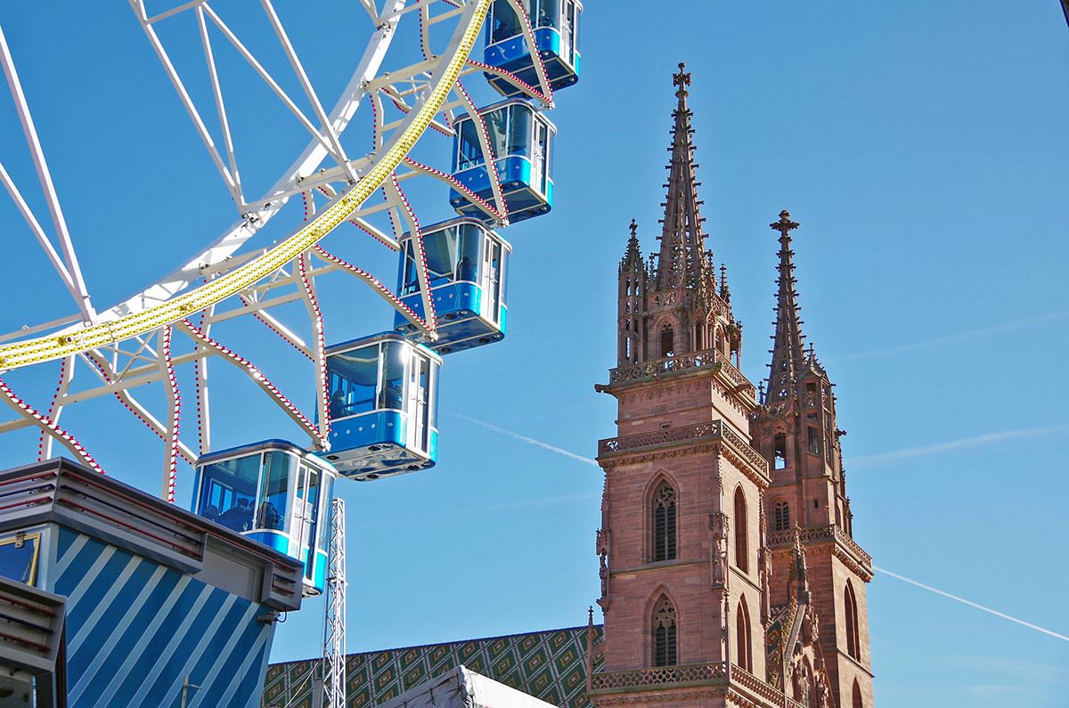A part of the Ferris wheel set near the cathedral at Münsterplatz in Basel, during Basler Herbstmesse or Basel Autumn Fair; photo by Chieh.