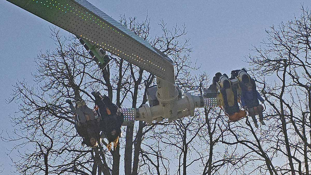 Visitors hanging upside down on Hip Hop amusement attraction at Basler Herbstmesse, Basel Autumn Fair, at Rosentalanlage; photo by Ivan Kralj.