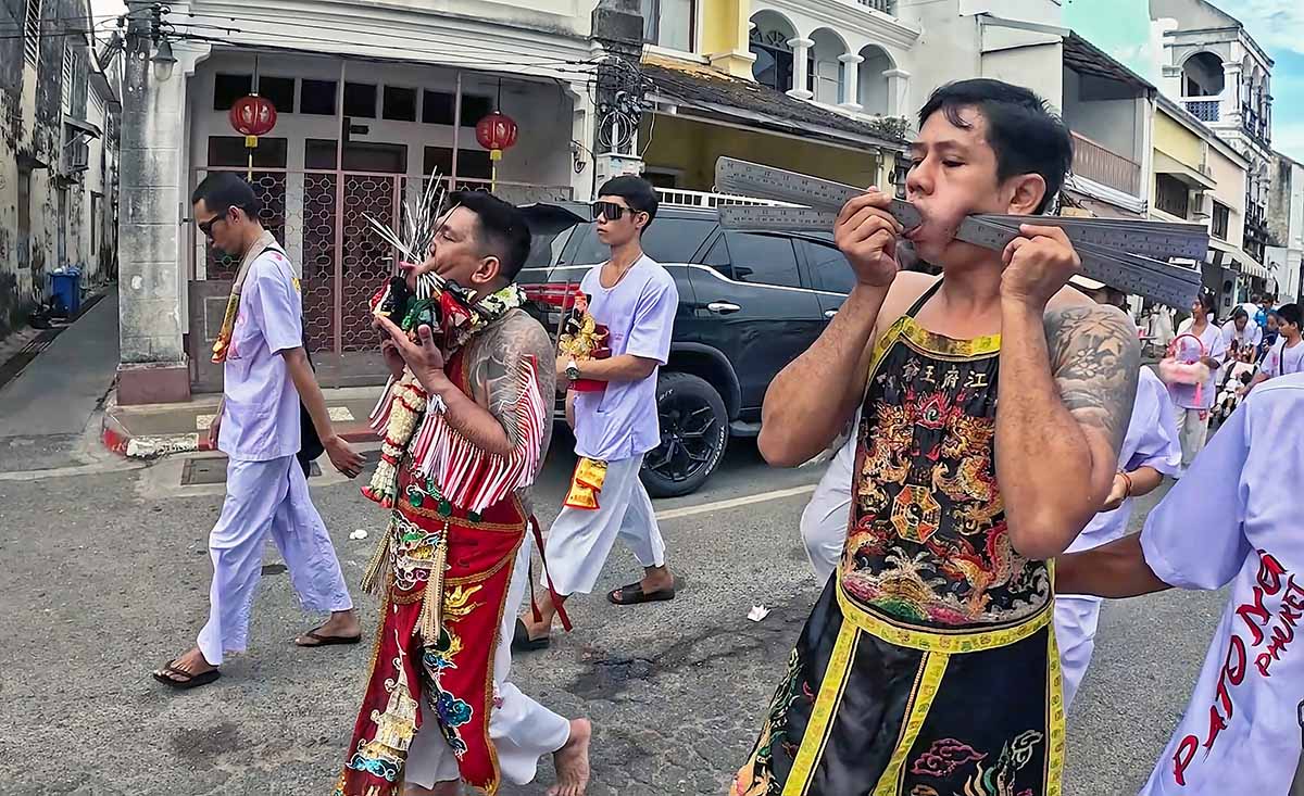 Ma song spirit mediums from Kathu Shrine walk the streets of Phuket while pierced with spikes and rulers, during the Phuket Vegetarian Festival; photo by Ivan Kralj.