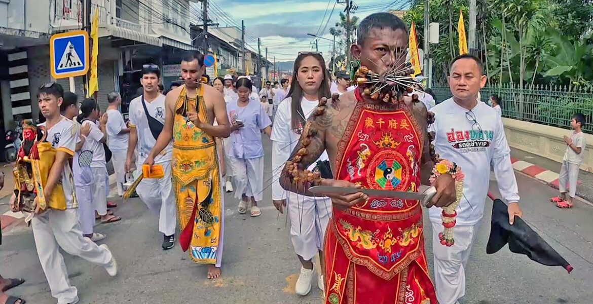 Cheek-pierced ma song spirit mediums from Kathu Shrine, Phuket, walking in a procession during the annual Nine Emperor Gods Festival; photo by Ivan Kralj.