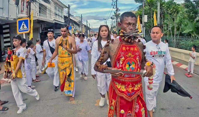 Cheek-pierced ma song spirit mediums from Kathu Shrine, Phuket, walking in a procession during the annual Nine Emperor Gods Festival; photo by Ivan Kralj.