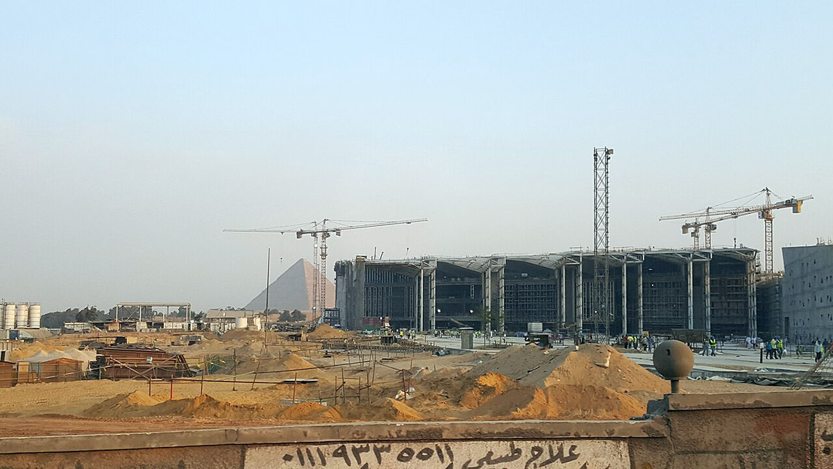 Cranes around Grand Egyptian Museum under construction, with Giza pyramid in the background, 2017; photo by ovedc.