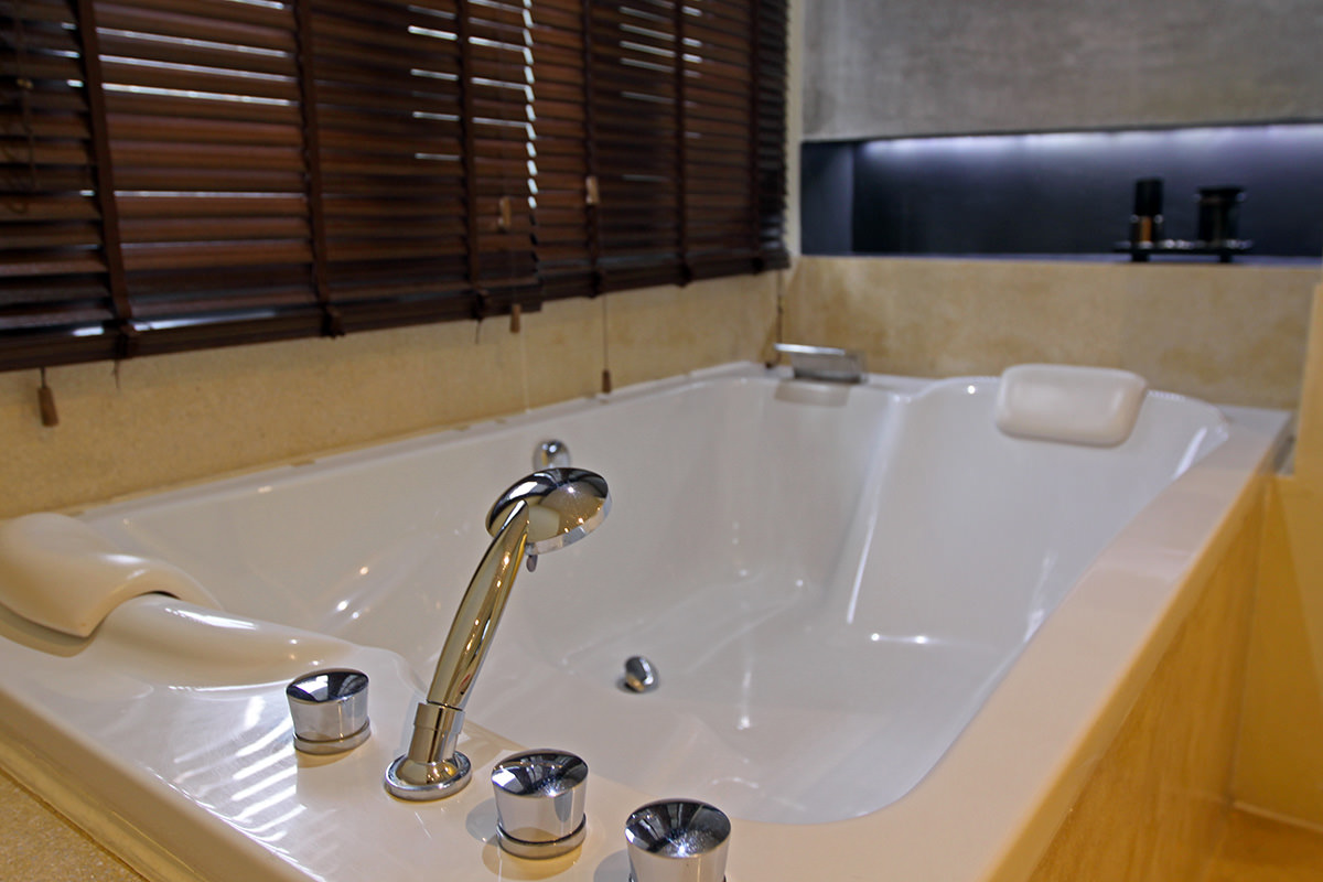 The close-up of a couple bath in one of the suites at Anda Mani Khao Lak Beachfront Villas; photo by Ivan Kralj.