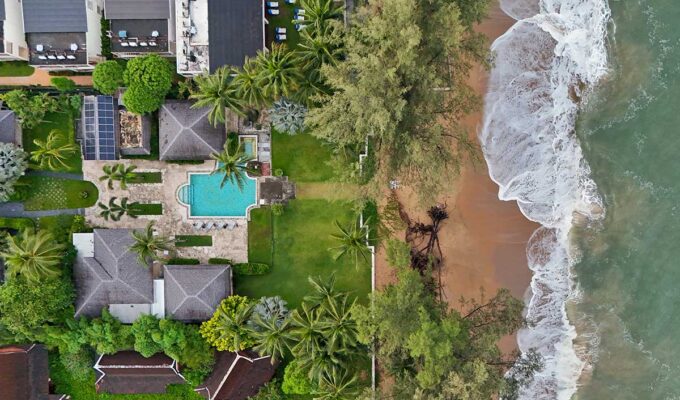 Aerial view of the Anda Mani Khao Lak Beachfront Villas in Phang Nga Province, Thailand, showing the resort's residences, greenery, and Lam Kaen Beach of Andaman Sea; drone photo by Ivan Kralj.