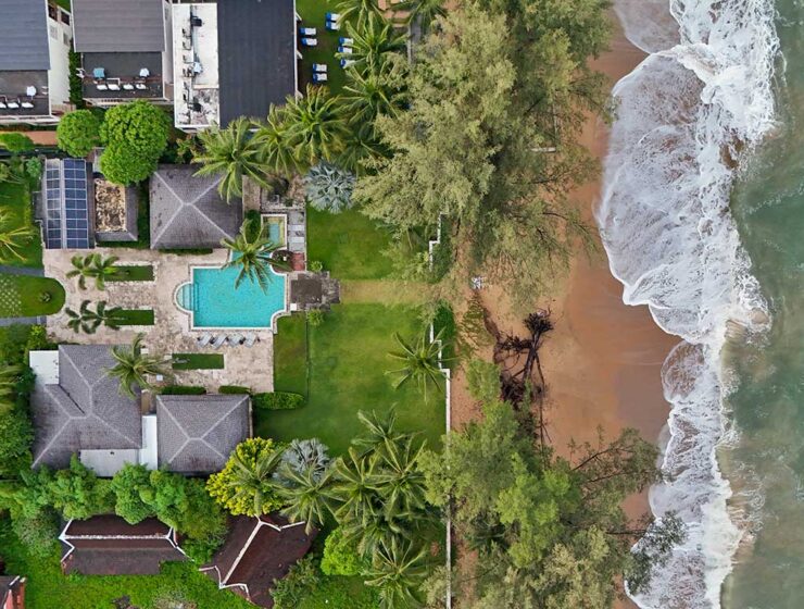 Aerial view of the Anda Mani Khao Lak Beachfront Villas in Phang Nga Province, Thailand, showing the resort's residences, greenery, and Lam Kaen Beach of Andaman Sea; drone photo by Ivan Kralj.