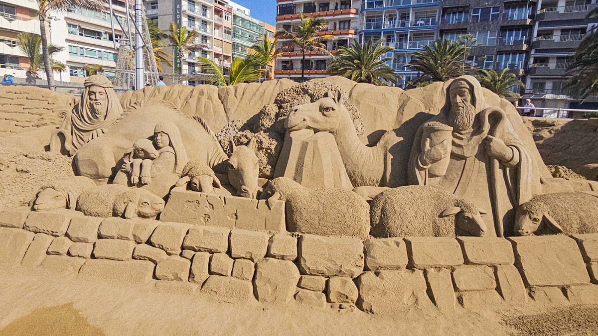 Shepherds with camels, sheep, and donkeys, all made from sand, as part of Belén de Arena, the sand nativity scene built on the beach of Las Palmas - Playa de las Canteras - for the 20th edition of this artistic project in Gran Canaria, Spain; photo by Ivan Kralj.