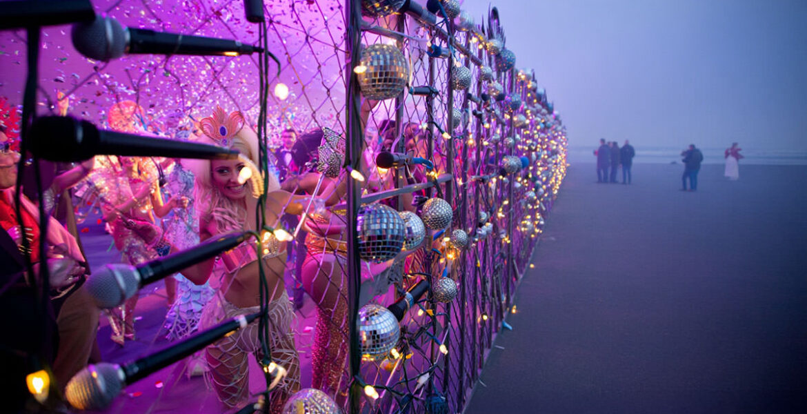 AI visualisation of the Eurovision Song Contest Live Tour party behind the glitter fence, after EBU's latest project deliberately concentrated its concerts only in Western Europe, leaving the rest of the continent behind the "iron curtain"; AI image by Ivan Kralj/ Reve, Adobe.