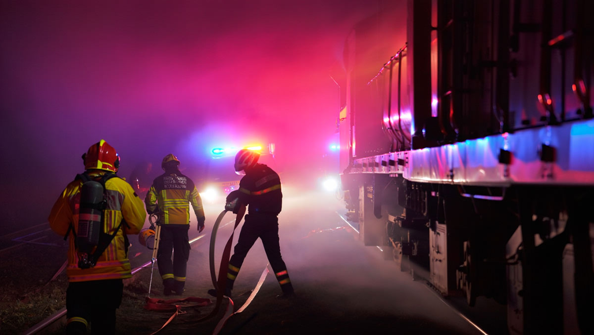Firefighters at the train crash scene; AI image by Ivan Kralj / Reve.