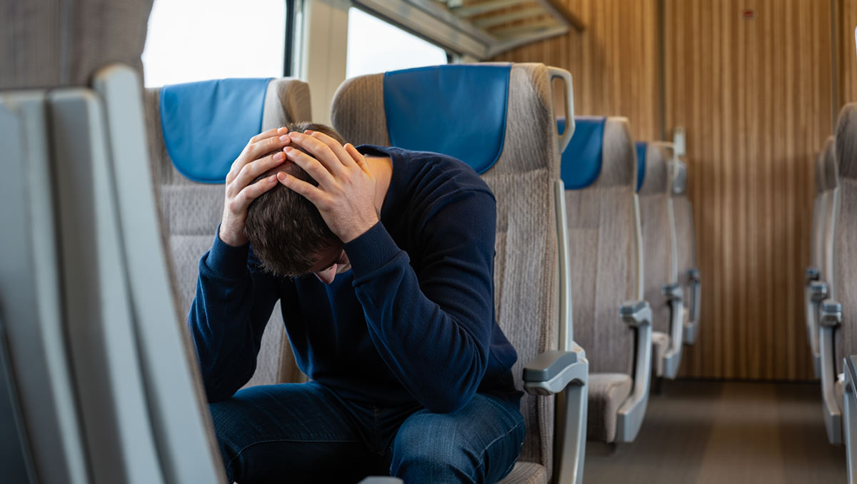 A man demonstrating a brace position on a train in case of an emergency; AI image by Ivan Kralj / Reve.