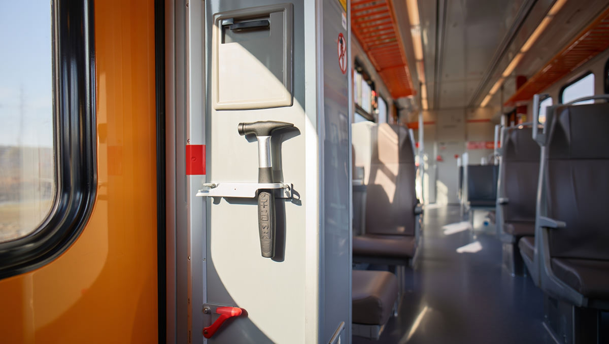 Emergency exit on a train, equipped with an escape hammer as a safety feature in the case of a train crash; AI image by Ivan Kralj / Reve.