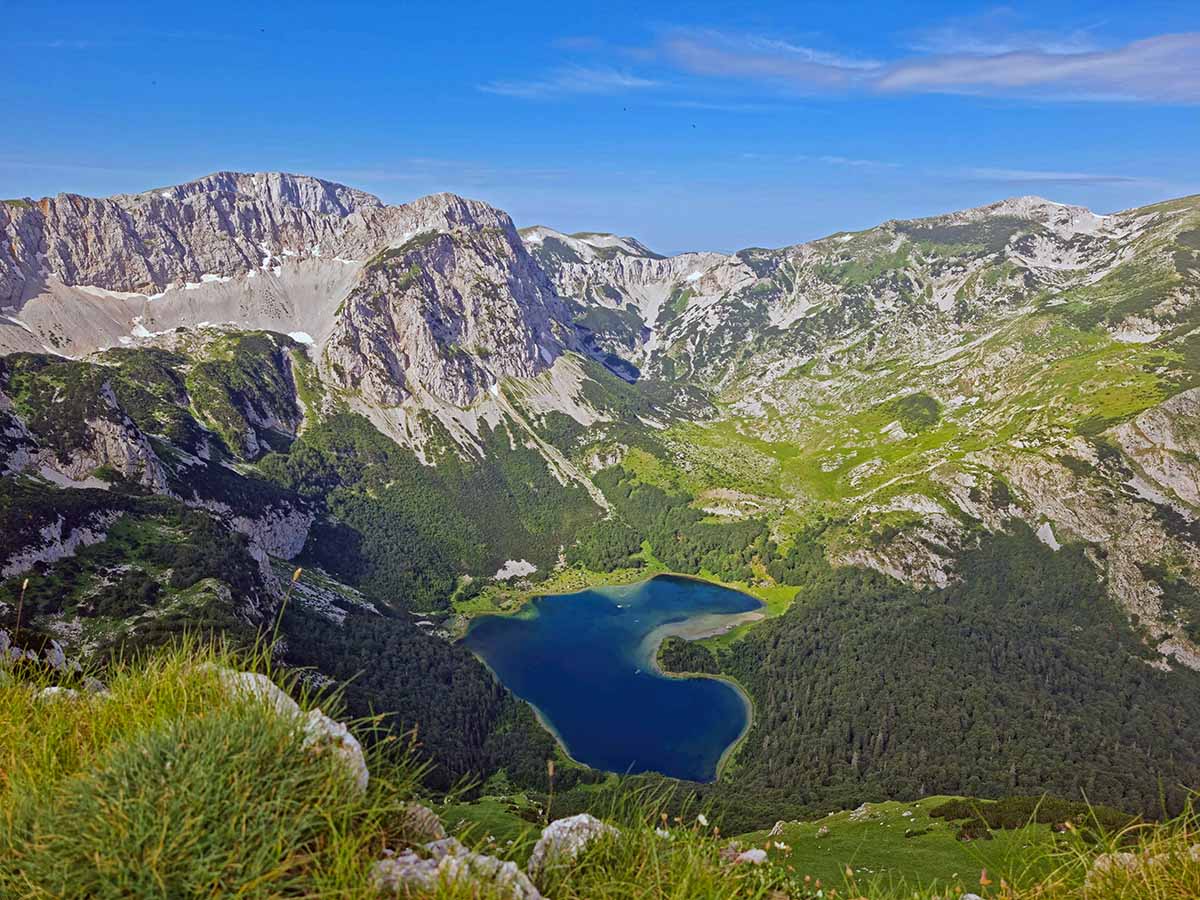 Trnovačko jezero, a heart-shaped lake in the mountains of Montenegro; photo by Goran Rakita, Pexels.